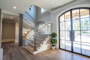L shaped staircase with white oak treads and handrail, with iron balusters