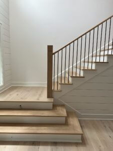 White Oak and white painted wooden L-shaped staircase