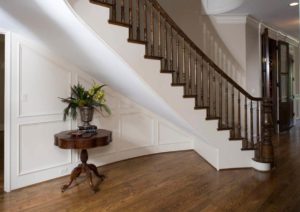 Curved starcase with hard maple handrail and wood balusters