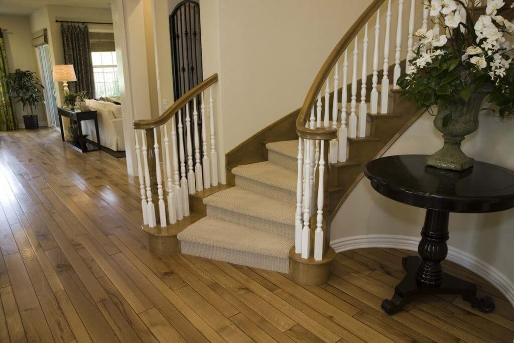 Stair Parts Oak and painted Poplar curves staircase with beige carpet runner