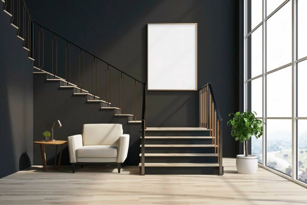 Modern L shaped staircase with light wooden treads and black iron balusters