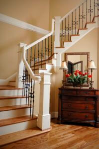 Classic wooden staircase with iron balusters